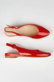 A model wearing size 37 of the Fairy in colour Redpatent (Red), from the front, showing the whole outfit