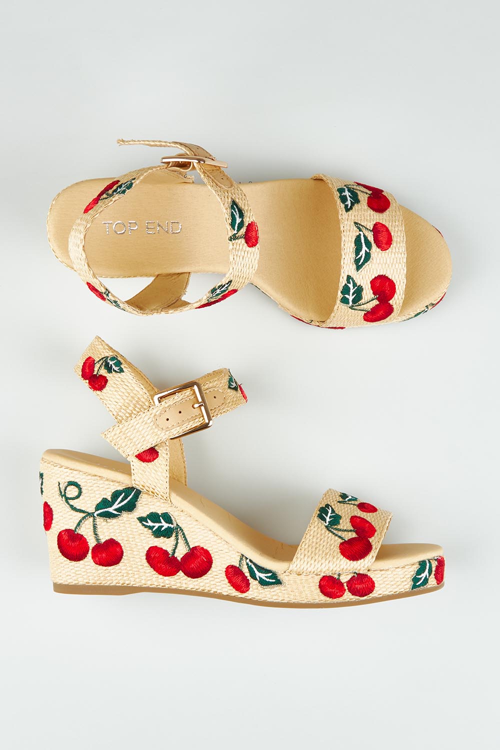 A model wearing size 37 of the Gossier Cherry Wedge in colour Cherries, from the front, showing the whole outfit