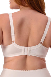 A model wearing the Endless Comfort Wirefree Bra in colour Freshpowde, from the back