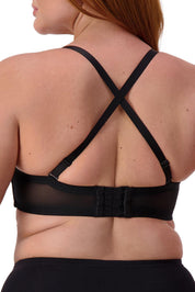 A model wearing the Beautiful Silhouette Bra in colour Black (Black), from the back