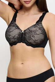 A model wearing the Contouring Sensation Minimiser Bra in colour Black (Black), from the front, showing the whole outfit