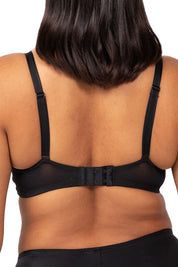 A model wearing the Sheer Minimiser Bra in colour Black (Black), from the back