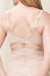 A model wearing the Shape Minimiser Airy Sensation Bra in colour Nudebeige, from the back