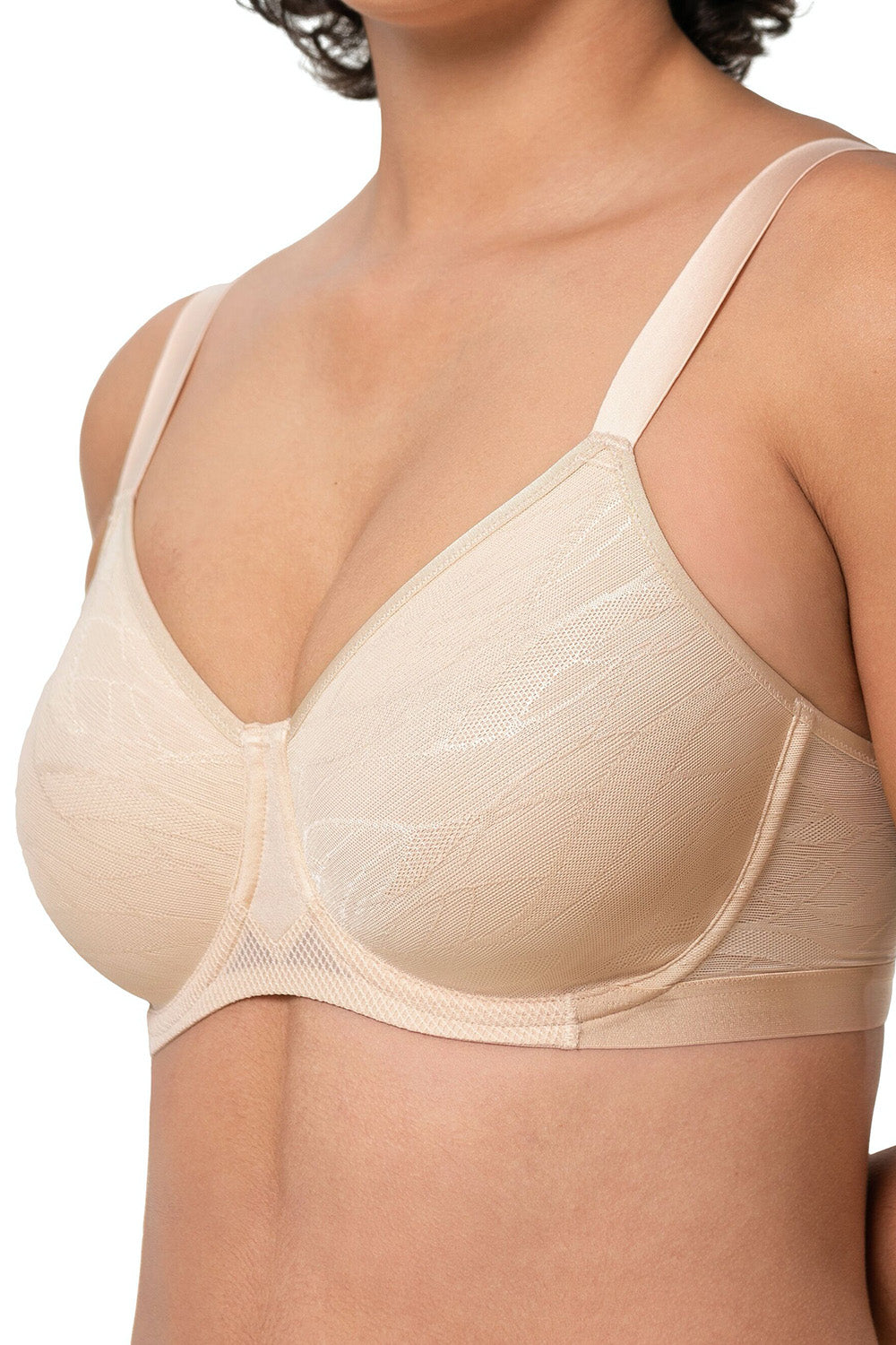 A model wearing the Shape Minimiser Airy Sensation Bra in colour Nudebeige, from the front, cropped image