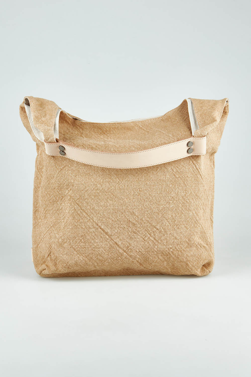 A model wearing size OneSize of the Leather Handle Tote Bag in colour Natural, from the front, showing the whole outfit