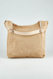 A model wearing size OneSize of the Leather Handle Tote Bag in colour Natural, from the front, showing the whole outfit