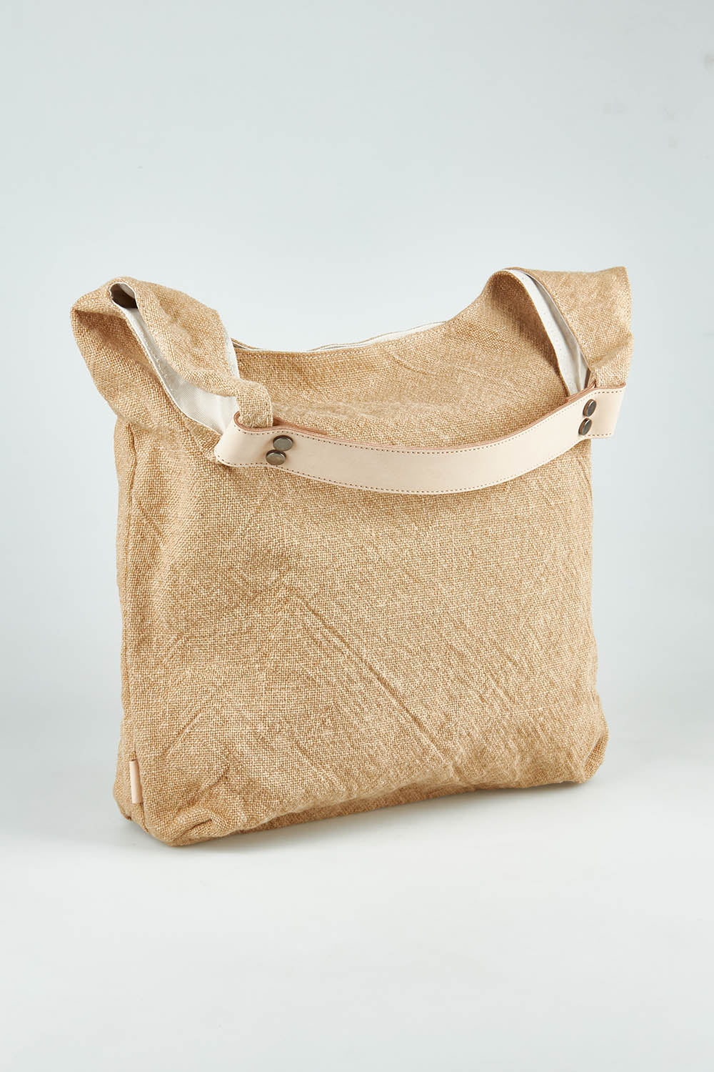 A model wearing size OneSize of the Leather Handle Tote Bag in colour Natural, from the front, showing the whole outfit