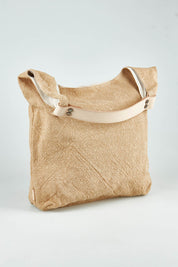 A model wearing size OneSize of the Leather Handle Tote Bag in colour Natural, from the front, showing the whole outfit
