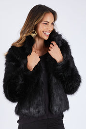 Model Amanda wearing size S of the Fur Delicious Jacket in colour Black (Black), from the front, cropped image