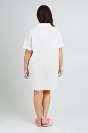 Model Poppy wearing the Cotton Short Sleeve Sleep Shirt in colour Milkwhite (White), from the back