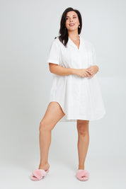 Model Poppy wearing the Cotton Short Sleeve Sleep Shirt in colour Milkwhite (White), from the front, showing the whole outfit