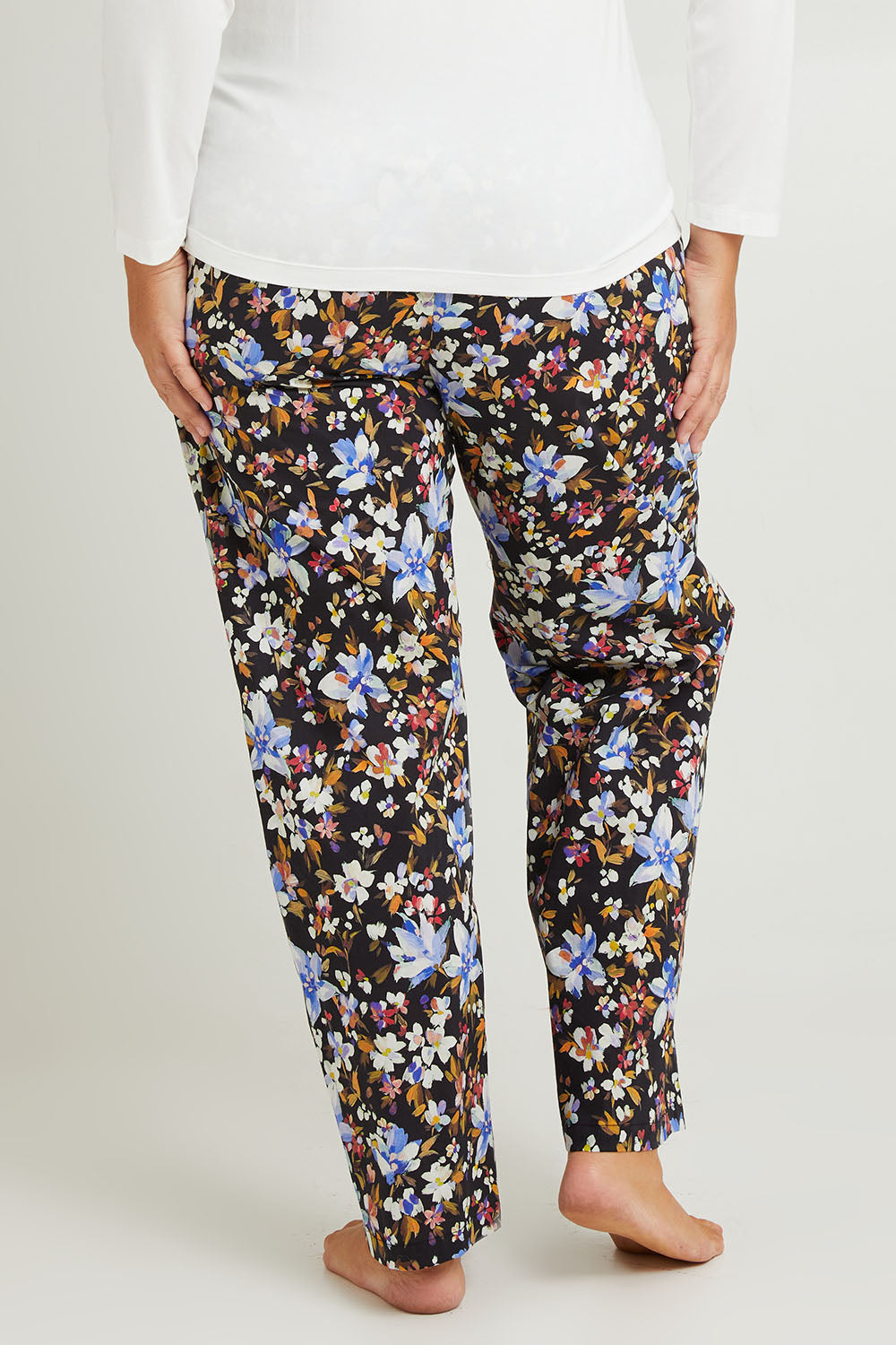 Model Fiona wearing the Winter Solstice Mercerised Cotton PJ Pants in colour Solstice (Black), from the back