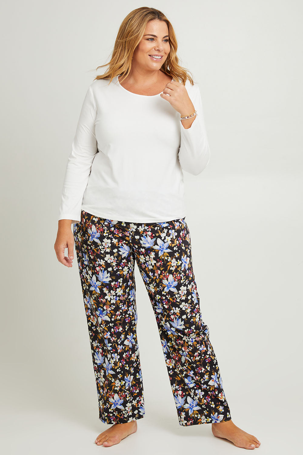 Model Fiona wearing the Winter Solstice Mercerised Cotton PJ Pants in colour Solstice (Black), from the front, showing the whole outfit
