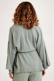 Model Emma wearing the Cotton Kimono With Belt in colour Sage (Green), from the back