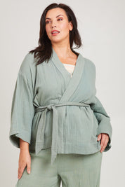 Model Poppy wearing the Cotton Kimono With Belt in colour Sage (Green), from the front, cropped image