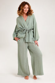 Model Emma wearing the Cotton Wide Leg Lounge Pant in colour Sage (Green), from the front, showing the whole outfit