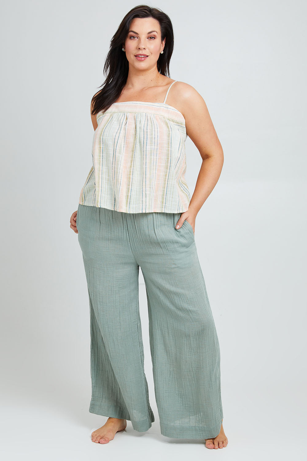 Model Poppy wearing the Cotton Wide Leg Lounge Pant in colour Sage (Green), from the front, showing the whole outfit
