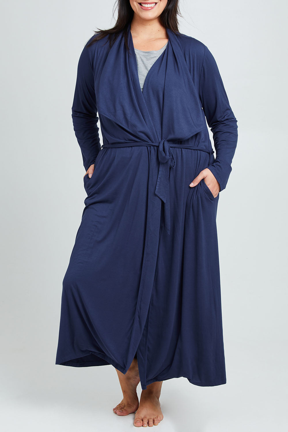 Model Poppy wearing the Jersey Wrap Maxi Cardi in colour Denimblue (Blue), from the front, cropped image