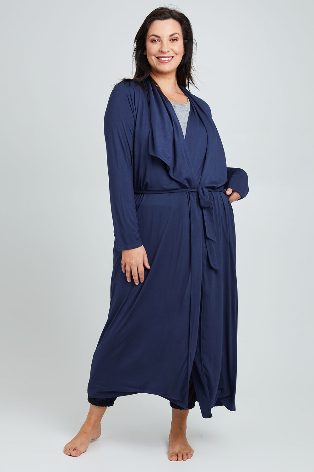 Model Poppy wearing the Jersey Wrap Maxi Cardi in colour Denimblue (Blue), from the front, showing the whole outfit