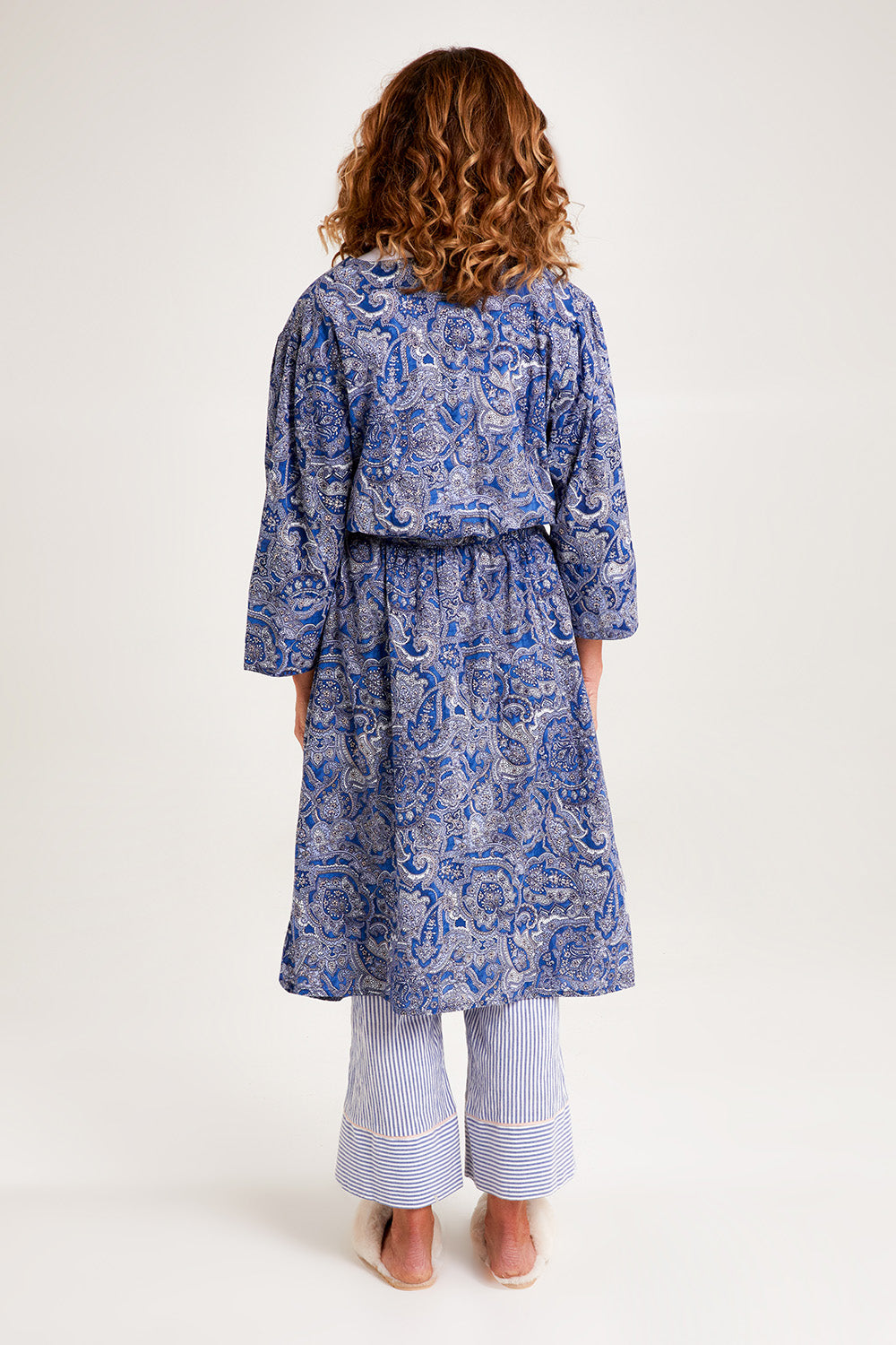 Model Emma wearing the Summer Cotton Robe With Tie in colour Navypais (Blue), from the back