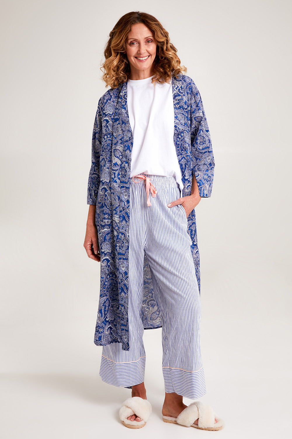 Model Emma wearing the Summer Cotton Robe With Tie in colour Navypais (Blue), from the front, showing the whole outfit
