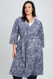 Model Poppy wearing the Summer Cotton Robe With Tie in colour Navypais (Blue), from the front, cropped image