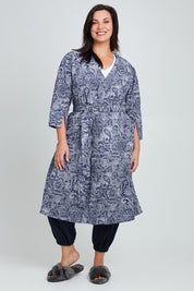 Model Poppy wearing the Summer Cotton Robe With Tie in colour Navypais (Blue), from the front, showing the whole outfit