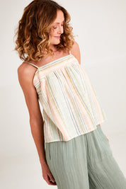 Model Emma wearing the Cotton Stripe Cami in colour Softstripe (Green), from the front, cropped image