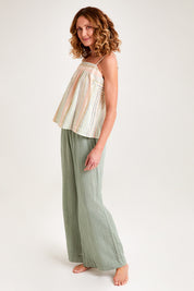 Model Emma wearing the Cotton Stripe Cami in colour Softstripe (Green), from the front, showing the whole outfit