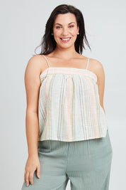 Model Poppy wearing the Cotton Stripe Cami in colour Softstripe (Green), from the front, cropped image