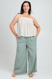 Model Poppy wearing the Cotton Stripe Cami in colour Softstripe (Green), from the front, showing the whole outfit