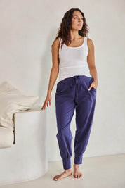 Model Tahneei wearing size 10 of the Cotton Jersey Pull On Jogger – Ink in colour Ink, from the front