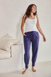Model Tahneei wearing size 10 of the Cotton Jersey Pull On Jogger – Ink in colour Ink, from the front