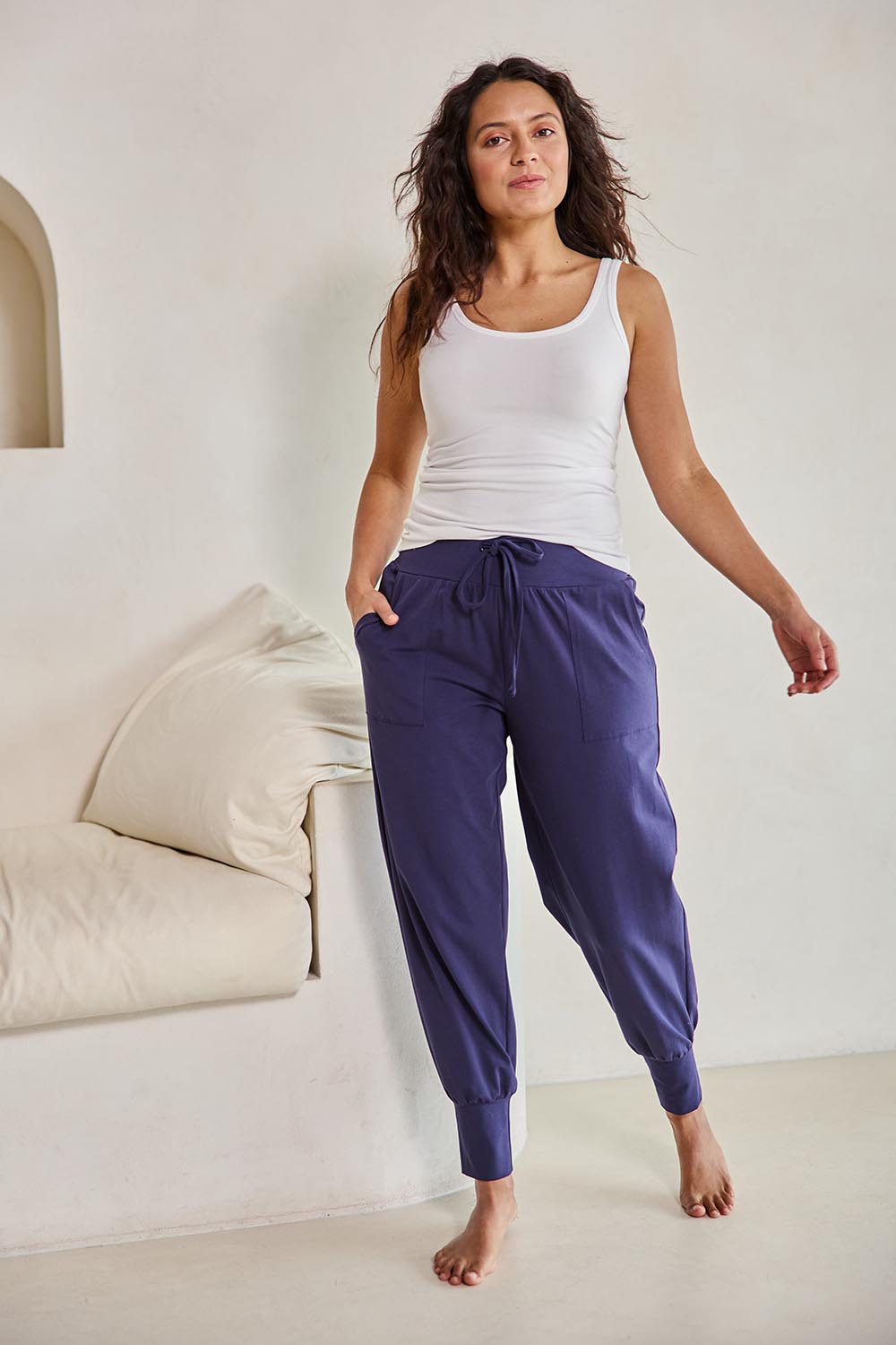 Model Tahneei wearing size 10 of the Cotton Jersey Pull On Jogger – Ink in colour Ink, from the front