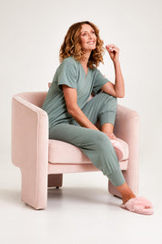 Model Emma wearing the Cotton Jersey Pull On Jogger in colour Sage (Green), from the front, showing the whole outfit