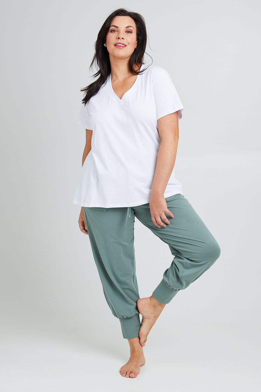 Model Poppy wearing the Cotton Jersey Pull On Jogger in colour Sage (Green), from the front, showing the whole outfit