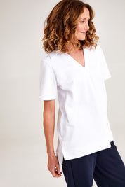 Model Emma wearing the Cotton Terry Collared Tee in colour White (White), from the front, cropped image