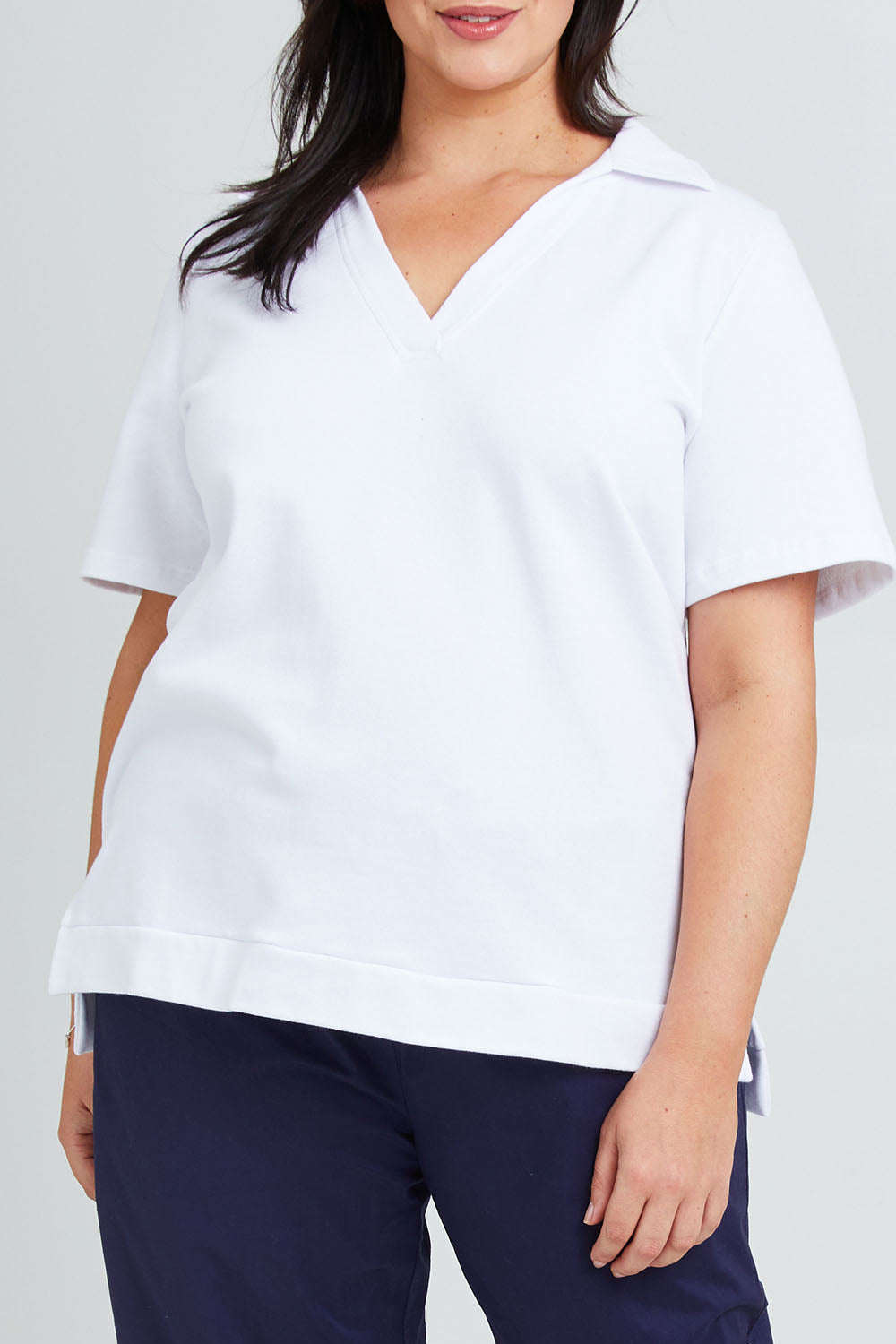 Model Poppy wearing the Cotton Terry Collared Tee in colour White (White), from the front, cropped image