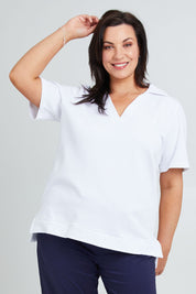 Model Poppy wearing the Cotton Terry Collared Tee in colour White (White), from the front, cropped image
