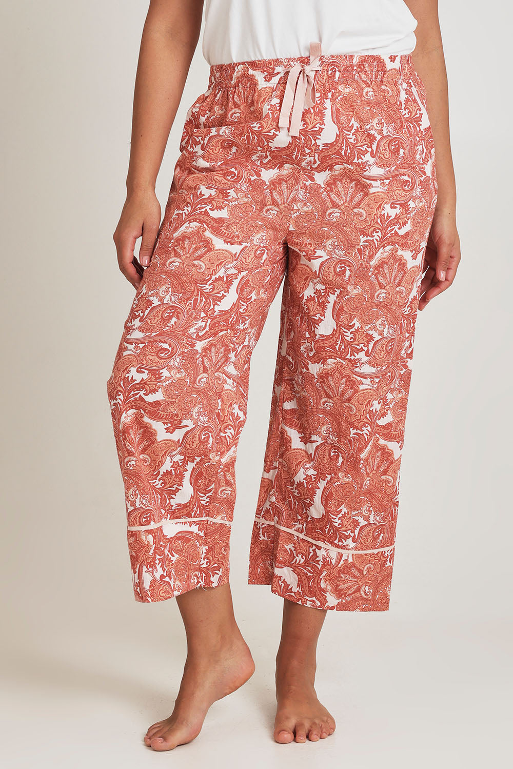 Model Terri-Leigh wearing the Cotton 3/4 Pyjama Pants in colour Paisley (Pink), from the front, cropped image