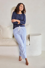 Model Tahneei wearing size 10 of the Cotton Seersucker Pyjama Pants – Bluewhite in colour Bluewhite, from the front