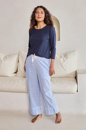 Model Tahneei wearing size 10 of the Cotton Seersucker Pyjama Pants – Bluewhite in colour Bluewhite, from the front