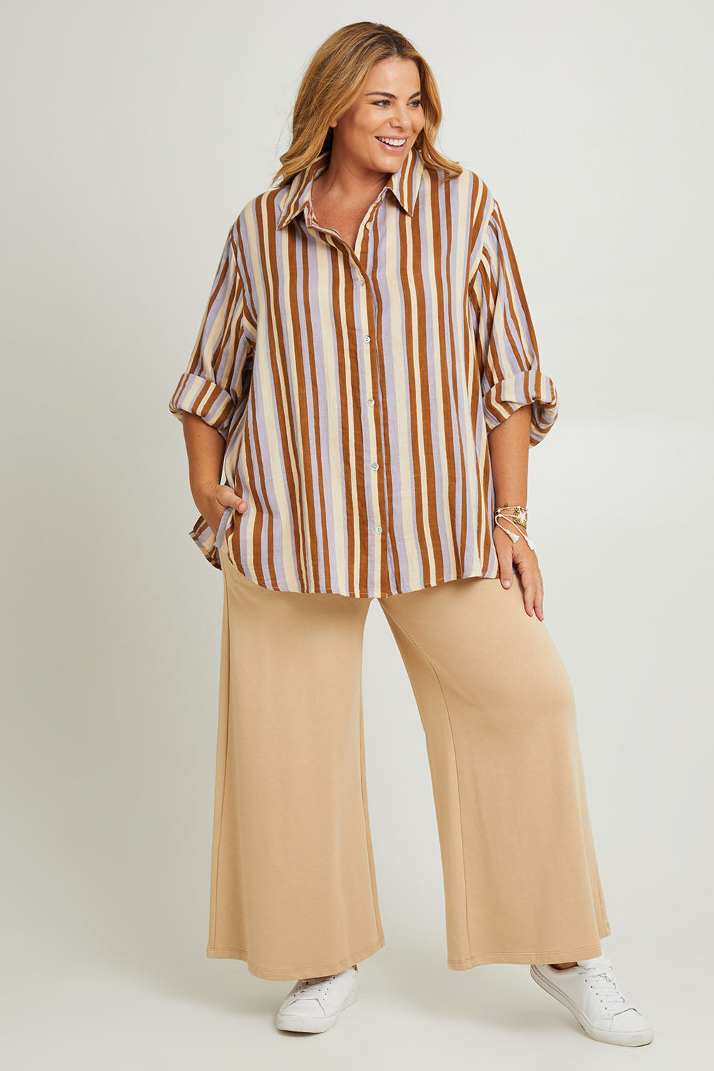 Model Fiona wearing the Striped Cotton Lounge Shirt in colour Lilacstrip, from the front, showing the whole outfit