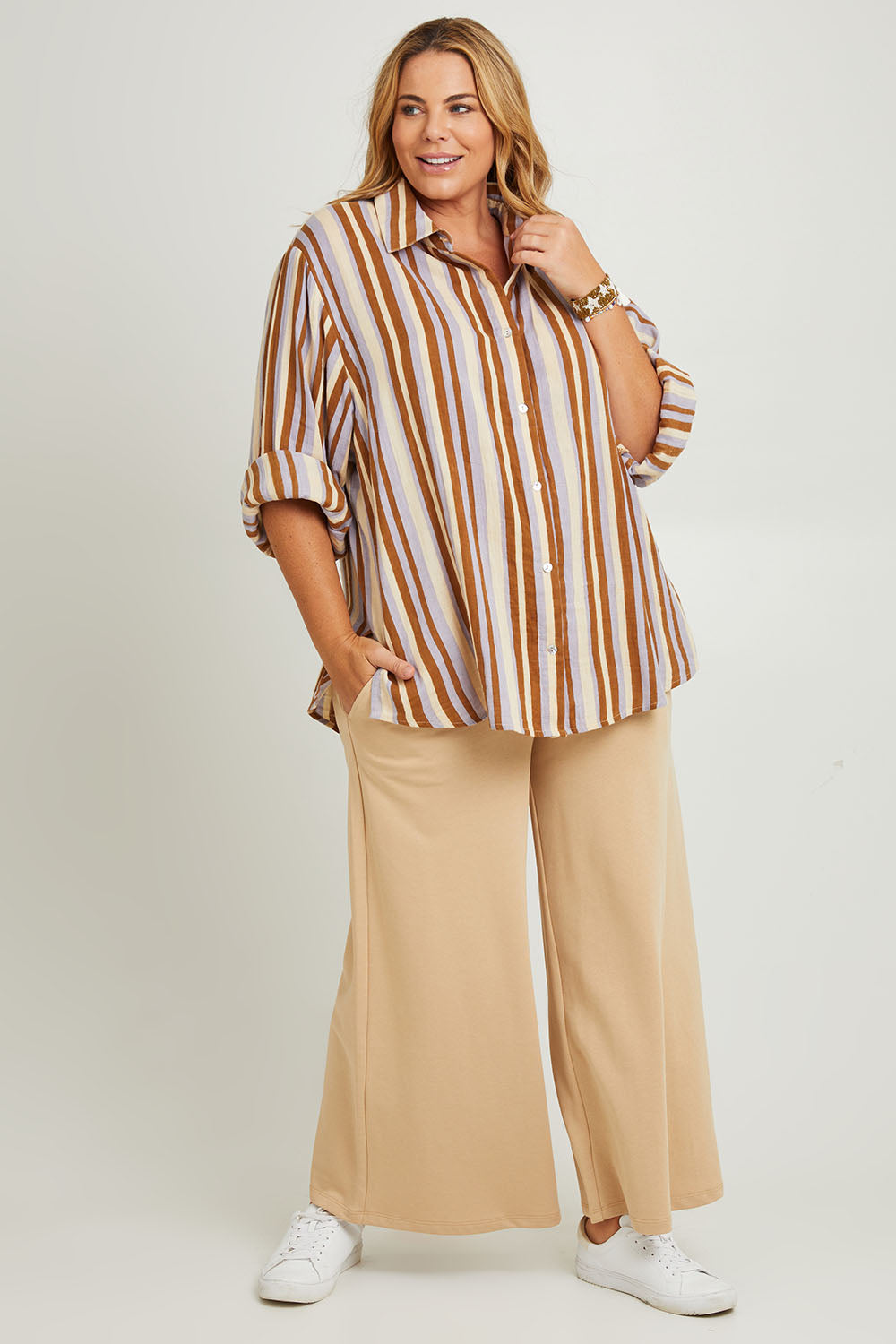 Model Fiona wearing the Striped Cotton Lounge Shirt in colour Lilacstrip, from the front, showing the whole outfit