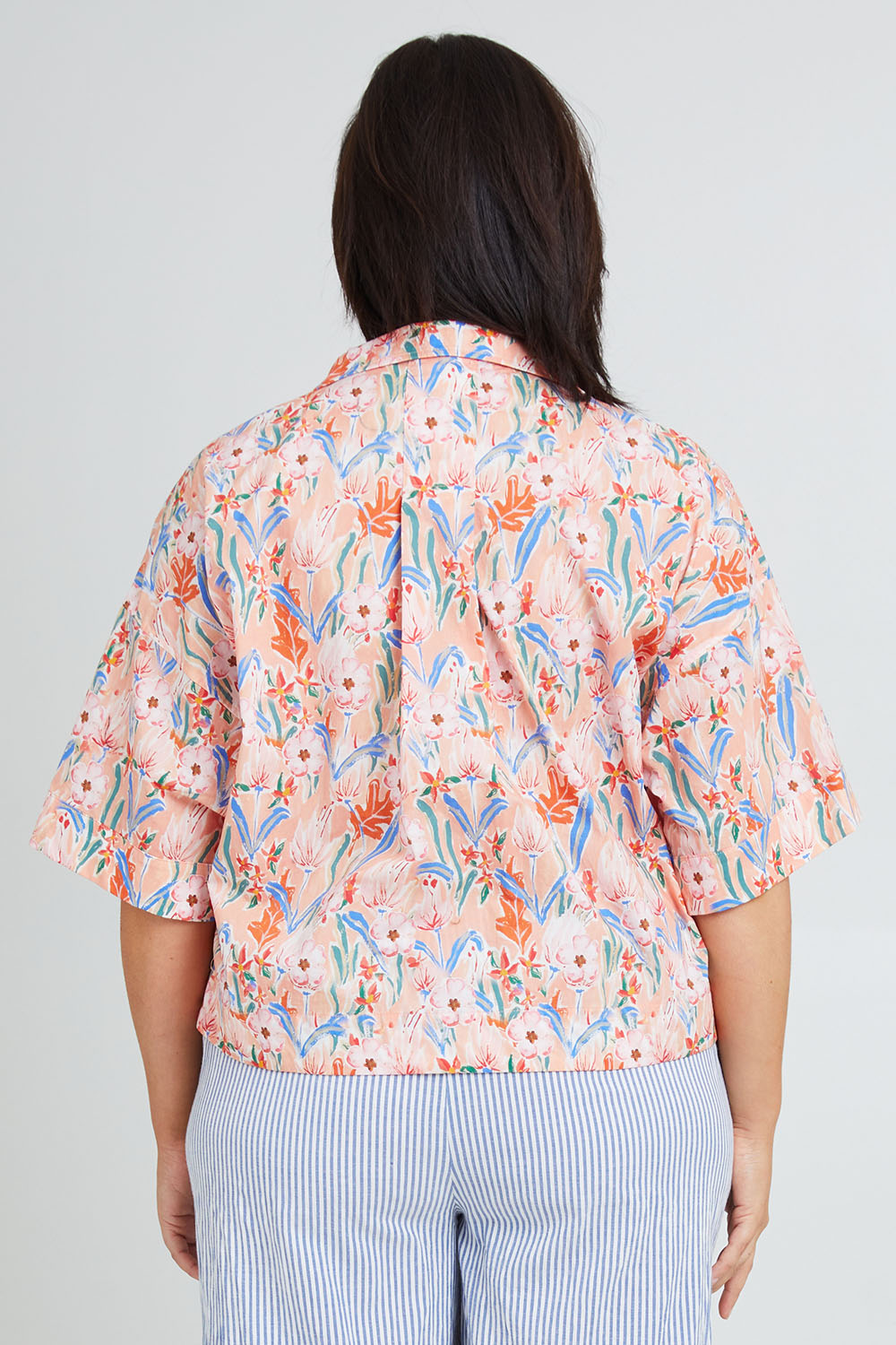 Model Poppy wearing the Golden Days Mercerised Cotton PJ Shirt in colour Golden, from the back
