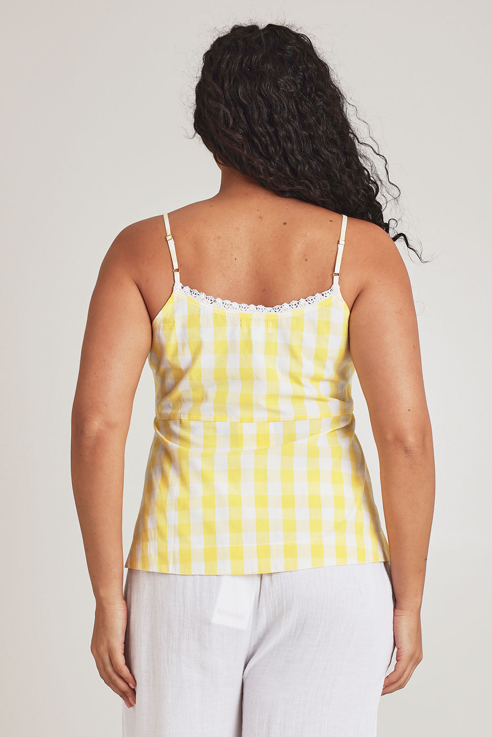 Model Terri-Leigh wearing the Cotton Gingham Cami in colour Buttercup, from the back