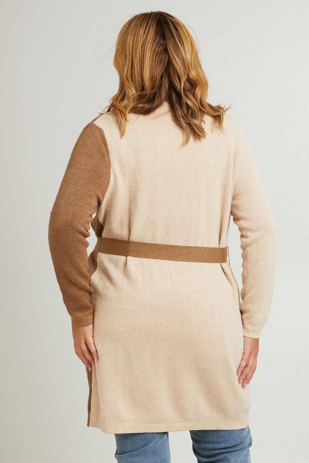 Model Fiona wearing the Colourblocked Longline Cardigan in colour Pancake, from the back