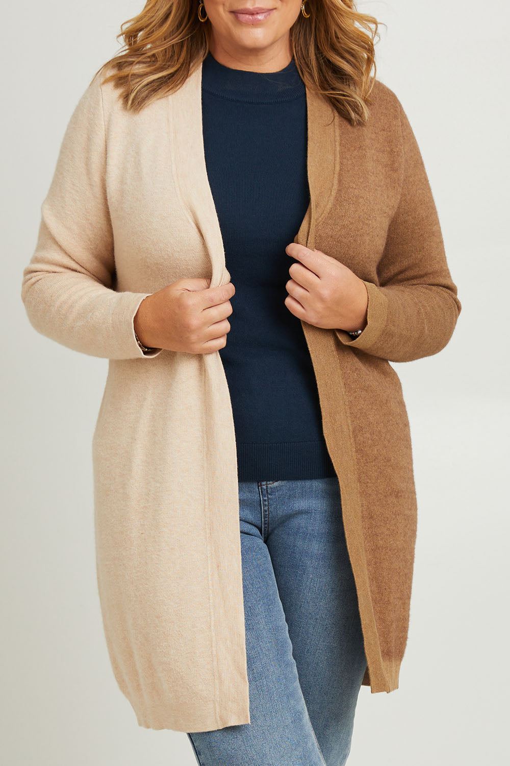 Model Fiona wearing the Colourblocked Longline Cardigan in colour Pancake, from the front, cropped image