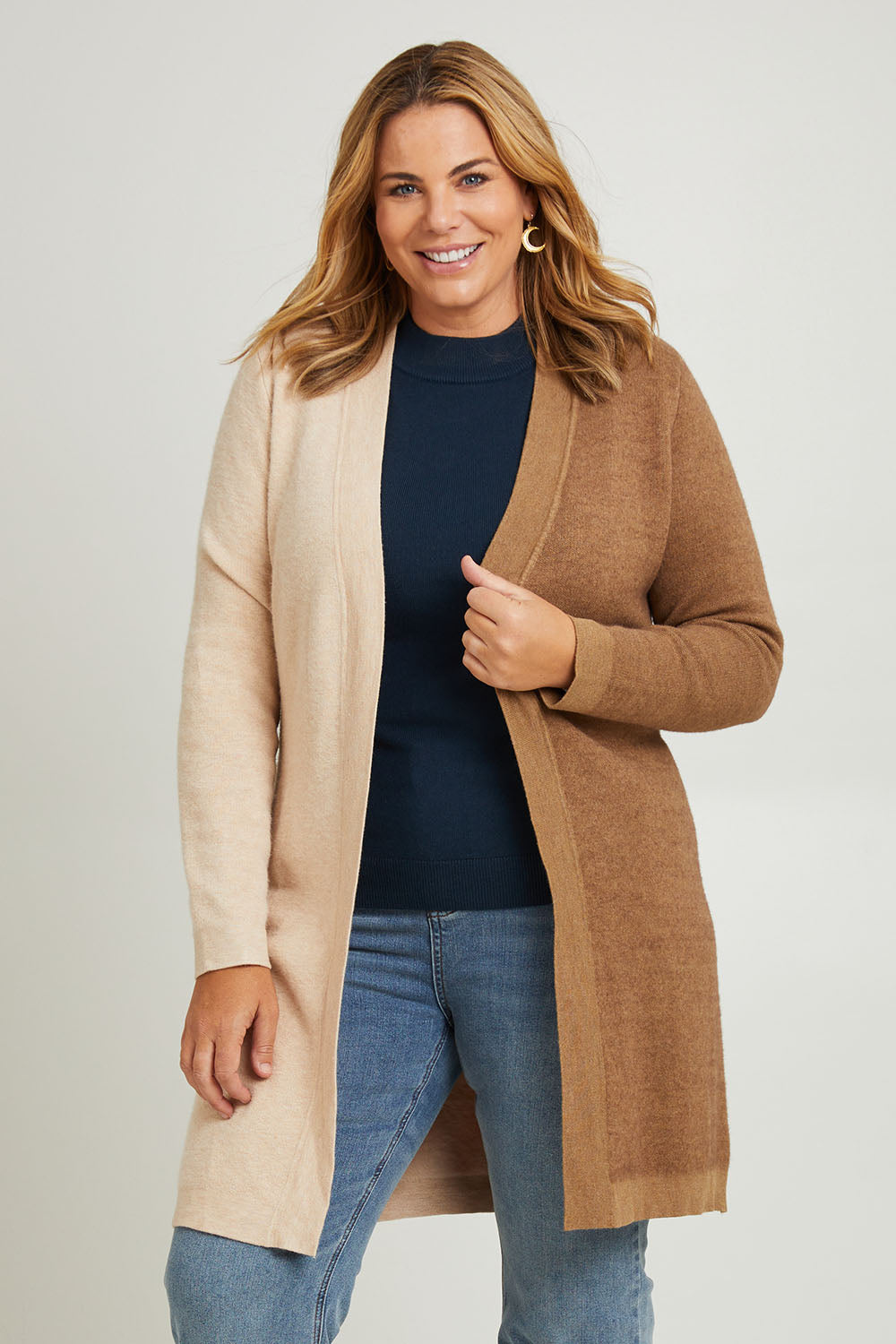 Model Fiona wearing the Colourblocked Longline Cardigan in colour Pancake, from the front, cropped image