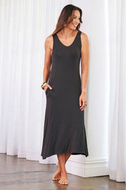 Model Amanda wearing the Modal Back Wrap Midi Dress in colour Deepgreen (Green), from the front, showing the whole outfit